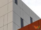 low-angle-view-modern-white-orange-building-bright-sky (1) (1)